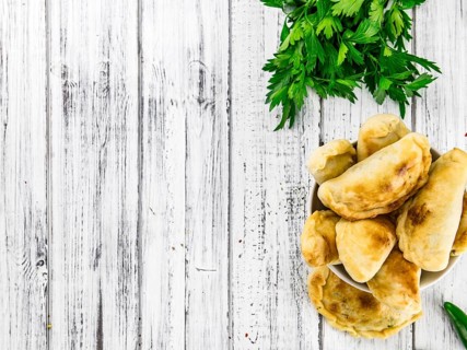 Portion of fresh homemade Empanadas as detailed close-up shot, selective focus