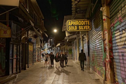 Strollers in an alley at night, closed shops, Monastiraki flea market, Athens, Greece, Europe