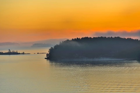 The Stockholm Archipelago along the Swedish coastline seen from the Baltic Sea with dramatic orange