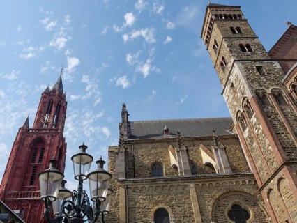 Church ensemble with Gothic towers and lanterns under a sunny sky, Maastricht, Limburg, Netherlands