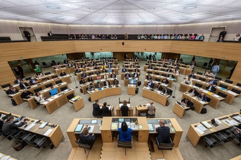 State parliament of Baden-Württemberg, assembly hall with state coat of arms. The seats of the