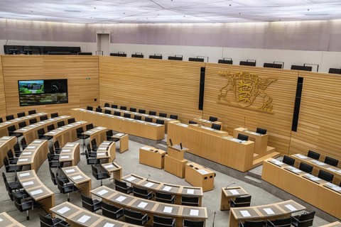 State parliament of Baden-Württemberg, assembly hall with state coat of arms. The seats of the