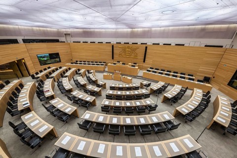 State parliament of Baden-Württemberg, assembly hall with state coat of arms. The seats of the