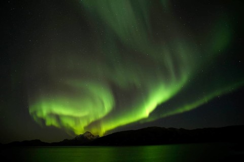 Auroras during new Moon in the bay near Gronnedal (Kangilinnguit), Southwest Greenland in Autumn