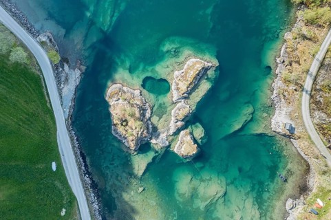 Aerial view of islands in lake Lovatnet (or: Loenvatnet), roads along the lake, Lovatn, valley
