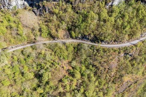 Aerial view of road along lake Lovatnet (or: Loenvatnet), gravel mountain road to Kjenndalstova,