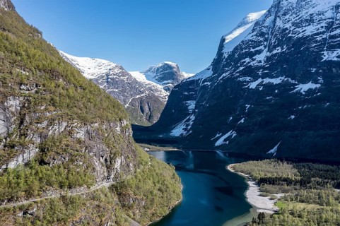 Aerial view of lake Lovatnet (or: Loenvatnet), gravel mountain road above the lake to glacier