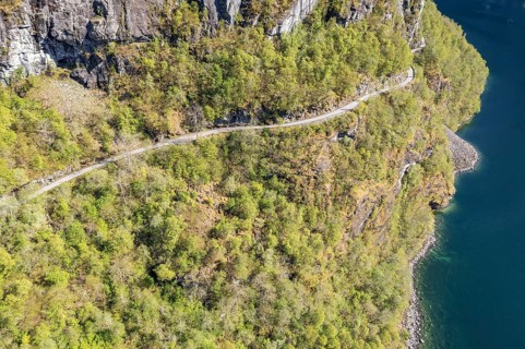 Aerial view of lake Lovatnet (or: Loenvatnet), gravel mountain road to Kjenndalstova, valley