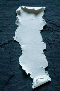 A piece of torn paper with ripped edges placed on a dark background, creating a strong contrast, AI