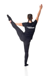 Personal Trainer standing with one leg up, isolated in white