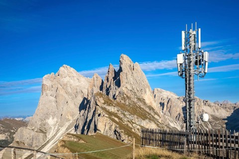 Mobile phone mast on the Seceda in front of the Geisler peaks, Val Gardena, South Tyrol