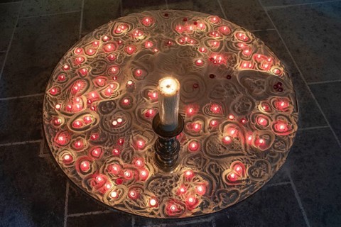 Burning devotional candles on sand in the Lorenzkirche, Nuremberg, Middle Franconia, Bavaria,