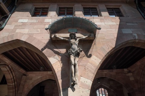 Crucifix in the inner courtyard of the historic Heilig-Geist-Spital, Nuremberg, Middle Franconia,