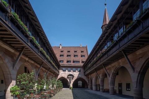 Inner courtyard of the historic Heilig-Geist-Spital, Nuremberg, Middle Franconia, Bavaria, Germany,