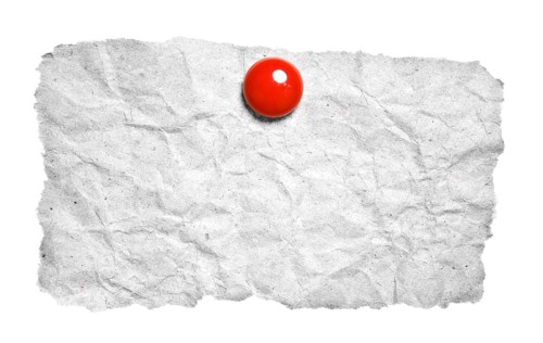 Torn paper with red clip isolated on white background. Ready for your message