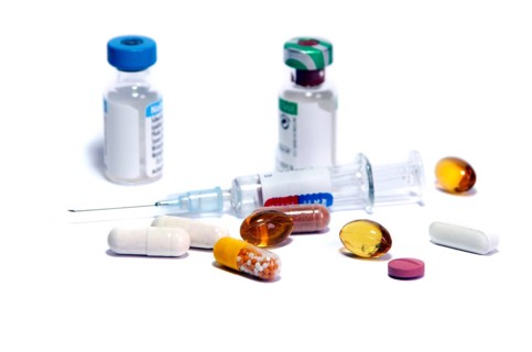Syringe and medicine bottles as symbol of doping