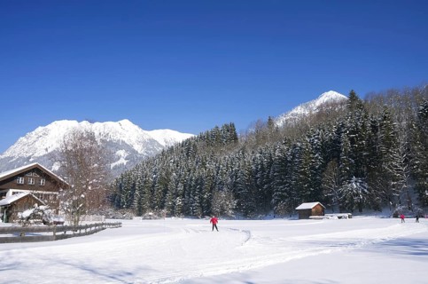 People on cross country ski-run in village