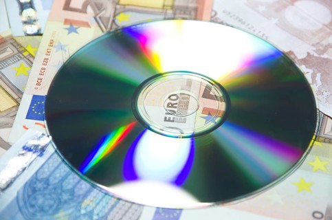 Money euro banknotes and a data cd in close up