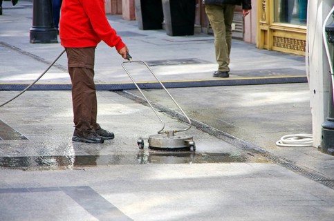 Road sweeper cleaning granite stone floor