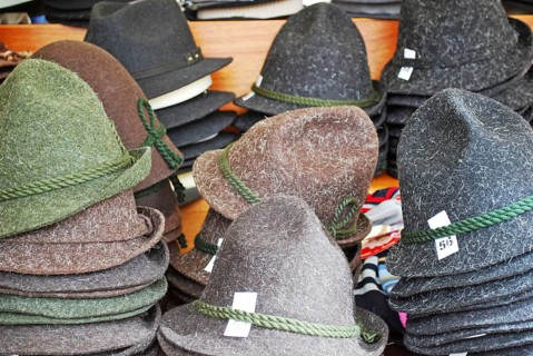 Many felt hats on a traditional bavarian market