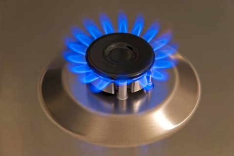 Blue gas flames of a steel gas stove