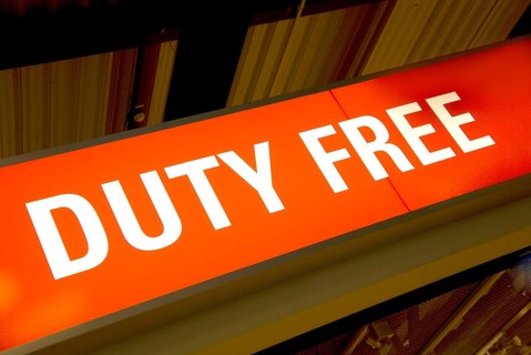Red illuminated sign with the words duty free