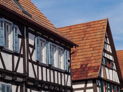 Traditional half-timbered houses with red tiled roofs and occasional open windows, Kandel,