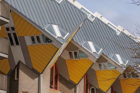 Cubist houses with yellow and grey pitched roofs and large windows, rotterdam, the netherlands