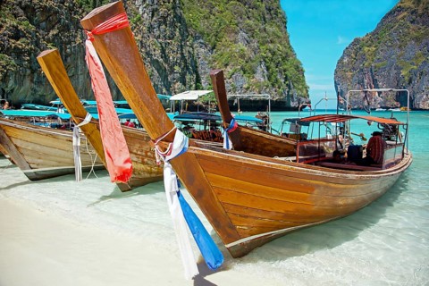 Long tail boats in the Maya Bay of Ko Phi Phi island Thailand