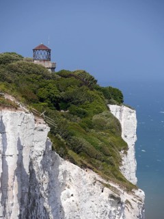 Dover chalk cliffs with lighthouse