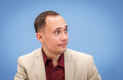 Silas Kropf, Chairman of the Board of MIA e.V., recorded during the Federal Press Conference for