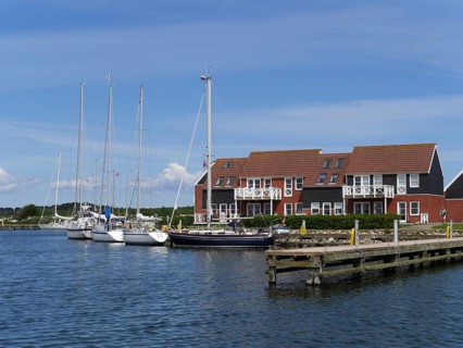 Klintholm Havn is a fishing village and popular holiday resort on the south coast of Mon, an island