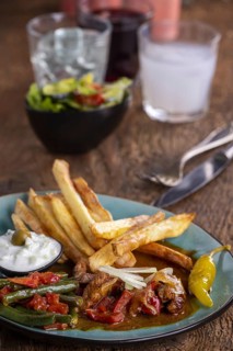 Greek gyros with metaxa sauce and chips