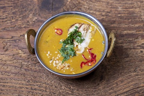 Indian mulligatawny soup in a brass bowl