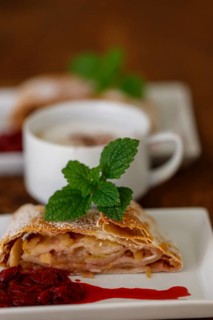 Austrian apple strudel on wood