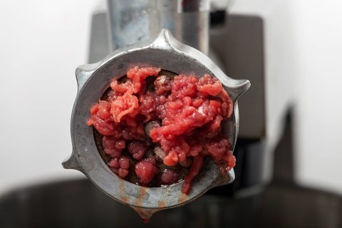 Close-up of meat in the mincer