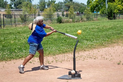 Detroit, Michigan, Fanella Felto, 73, competes in the Softball Hit at the Detroit Senior Olympics.
