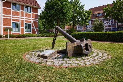 Historic anchor in front of Jork town hall, Altes Land, Stade district, Lower Saxony, Germany,