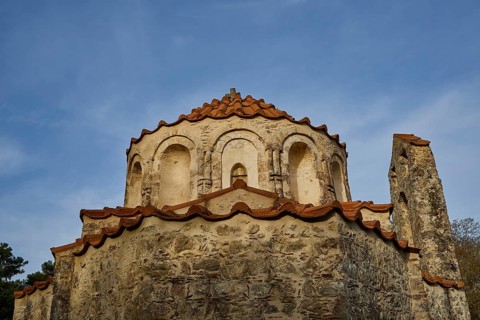 Close-up of the dome and roof of a historic church with a blue sky in the background, Byzantine