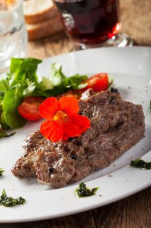 Grilled steak with nasturtium