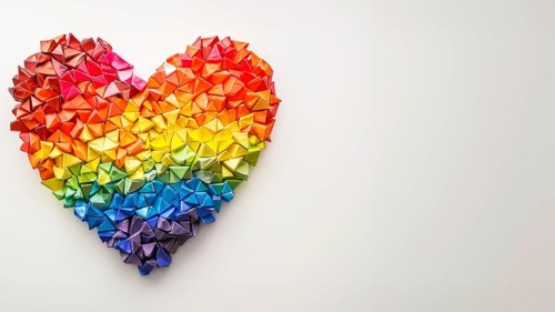 A heart made of LGBT rainbow flag colors over white background and copy space, AI generated