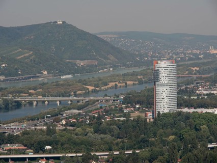 City panorama with modern skyscraper and several rivers crossing the landscape, Vienna, Austria,