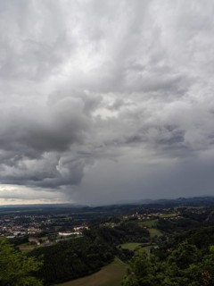 Storm clouds over Leibnitz, Seggau Castle, Frauenberg pilgrimage church in the background, view