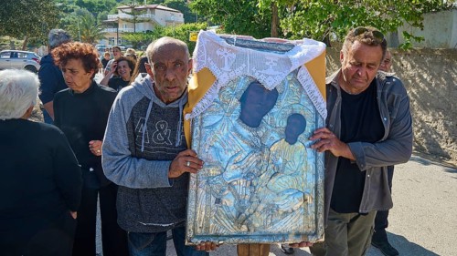 Men carrying a religious icon during a solemn procession, Procession of the icon of Panagia Skiadni