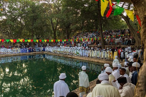 People gathering at Timkat festival at Fasilides Bath in Gondar, Ethiopia, Africa