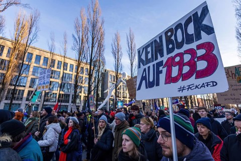 People holding banners against the right wing party AfD at a manifastation in Munich, Germany,