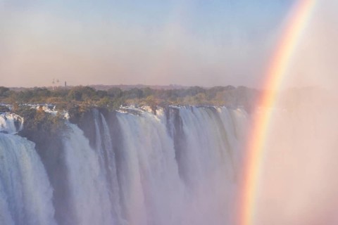 Close-up of the victoria falls in Zimbabwe, on a late afternoon with rainbow