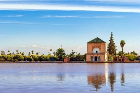 Famous Saadian pavillon reflecting in pool at Menara Gardens