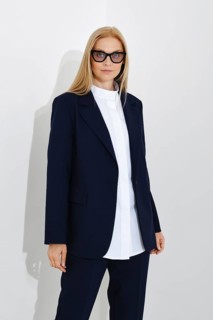 Studio portrait of self-assured business woman on white background