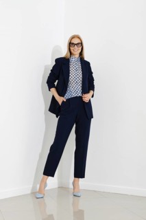 Professional blonde woman representing a modern corporate fashion